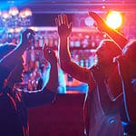 people-dancing-in-front-of-bar